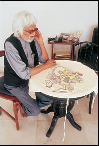Husain diverts his energies to painting a sketch on Farzana Contractor's apron.
