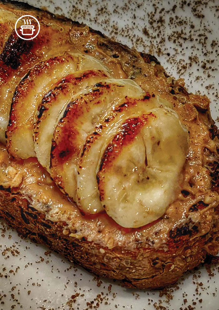 four-desserts-are-arranged-on-a-plate-with-chocolate-chips-bananas-and