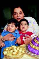 With grandchildren Iman and Vivan, who are a handful, and a bowlful of son Chetans Napolean Chocolates.