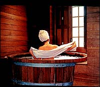 The Wine Barrel Bath, part of the Top-to-Toe Special Vintage Package that has body and facial treatment where you are plunged into a red vine bath.