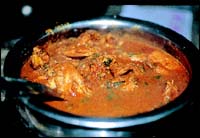 The Kombdi Masala, a watery thing chicken curry that is spicy hot and best enjoyed by dunking Bhakri into it.