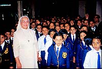 Sr. Mary Adelia, who is the kitchen in-charge, with junior students of St. Josephs Convent waiting to have lunch.