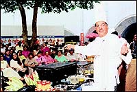 Idli King Vithal Kamat demonstrates South Indian cooking in the Courtyard.