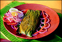 Karimeen Porichathu... Keralas popular backwater fish, the Pearlspot, cooked in a banana leaf.