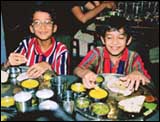 The restaurant is long and narrow, tables for four on both sides, like the dining car of a train. Probably that is why it is called the Rajdhani. 