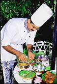 Chef Timmaiah sets a table at the Karavalli.